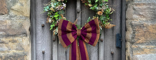 large bow on wreath on front door