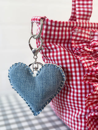Ethically made heart-shaped denim keyring clipped to gingham bag – The Well Worn accessory