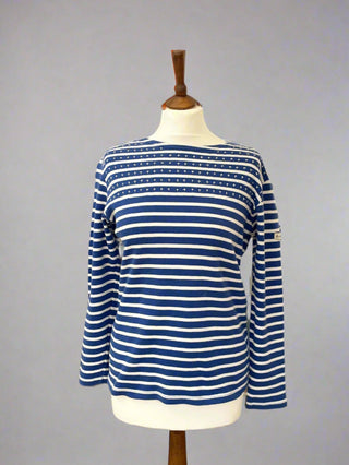 Blue and white striped shirt on a mannequin against a gray background