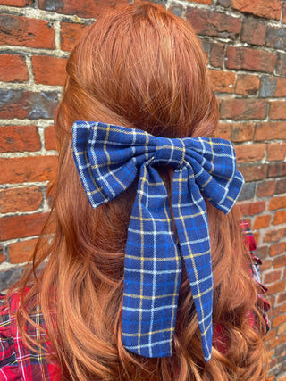 women wearing navy hair bow