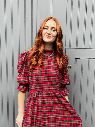 women wearing red tartan dress detail