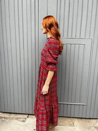 women wearing red tartan dress side