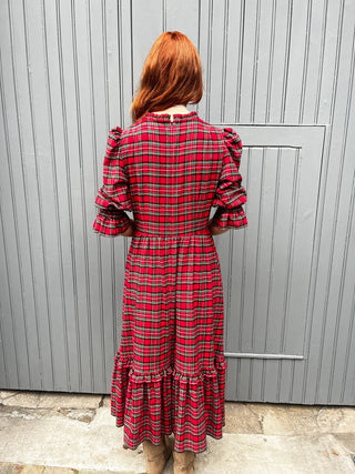 women wearing red tartan dress back