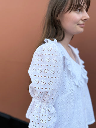 women wearing embroidered blouse