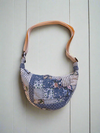 quilted bag on wooden boards