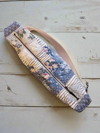 quilted bag on floorboards