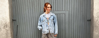 model wearing upcycled denim jacket the well worn