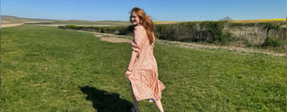 Women Running in The Well Worn Made-UK Ethical Everyday Dress, showcasing its timeless design and sustainable fabric