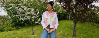 Woman wearing an upcycled vintage quilt waistcoat with pink floral details, made in the UK by sustainable fashion brand The Well Worn