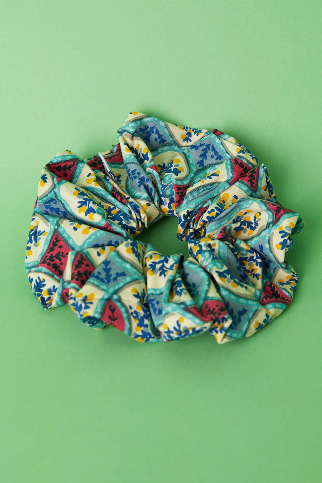 The Well Worn vintage floral scrunchie on green background