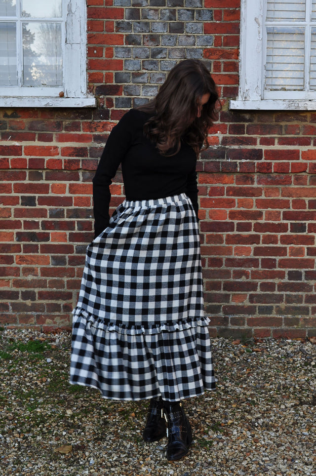 woman wearing winter gingham skirt