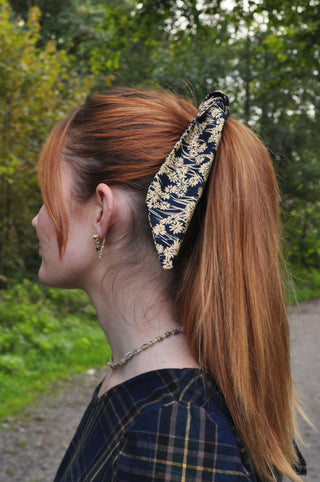 women wearing printed hair tie