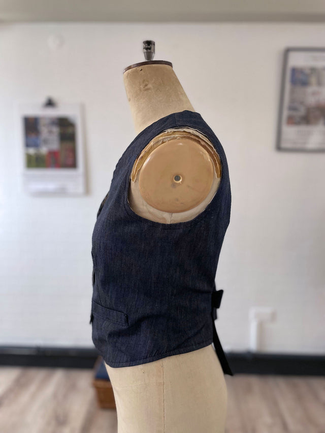 The Well Worn denim waistcoat on mannequin side view