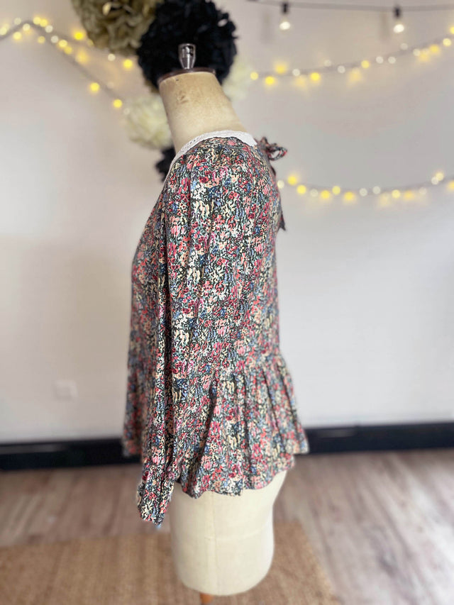 The Well Worn side view floral top on mannequin