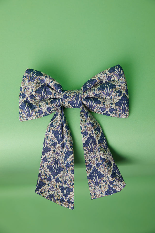The Well Worn blue printed bow on table