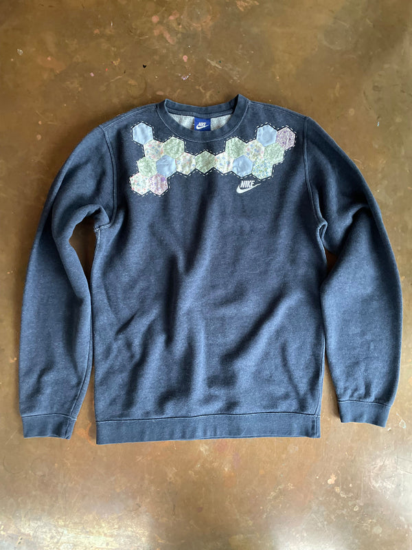 The Well Worn reworked sweatshirt on table