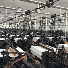 The Well Worn traditional weaving looms in factory