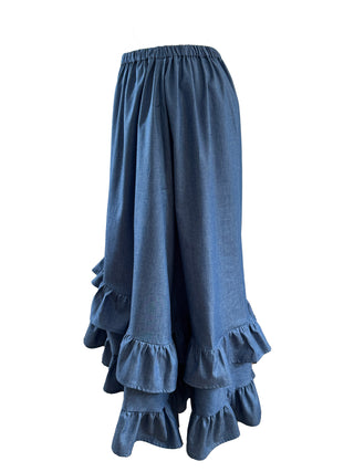 Blue denim skirt with ruffled layers on a white background