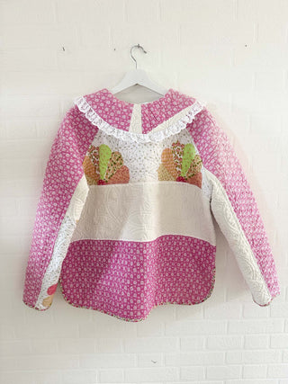 quilted jacket hanging on wall 