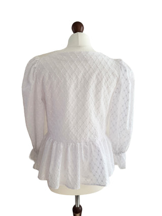 Romantic white broderie anglaise blouse with pink bows, crafted sustainably to order