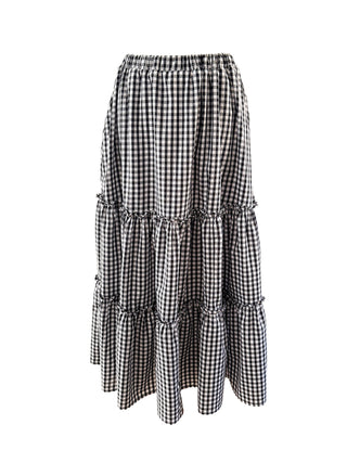 The Romana Gingham Tiered Maxi Skirt with ruffled tiers, elasticated waistband, and side pockets in black & white check.