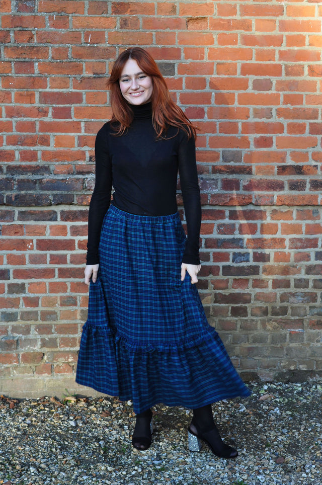 women wearing check skirt
