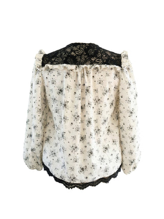 back floral blouse on mannequin