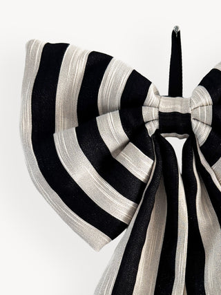 Black and white striped bow on a white background