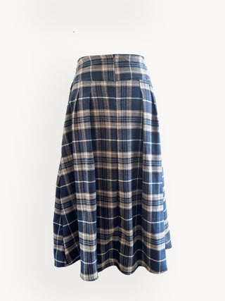 Plaid skirt with blue and beige pattern on a white background