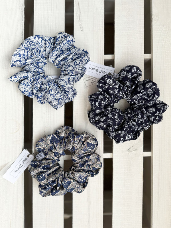The Well Worn blue scrunchies on white background