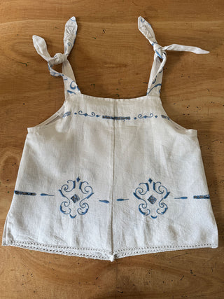 blue embroidered cami on table