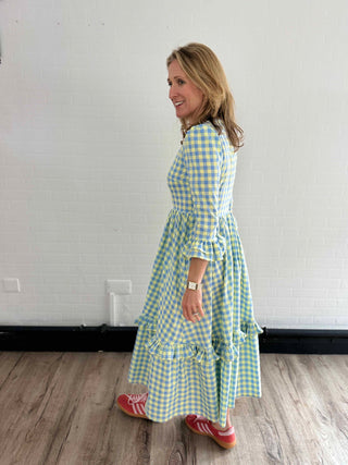 side view woman wearing dress with pockets
