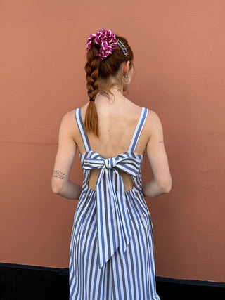 model wearing stripe dress bow detail