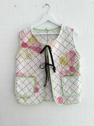 quilted waistcoat hanging on wall
