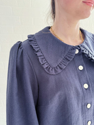 Sustainable French Navy Blouse with oversized collar and corozo buttons on model