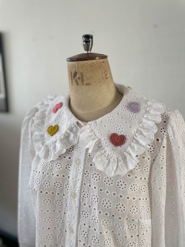 collar heart motif blouse on mannequin