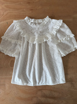 ruffle detail top on table