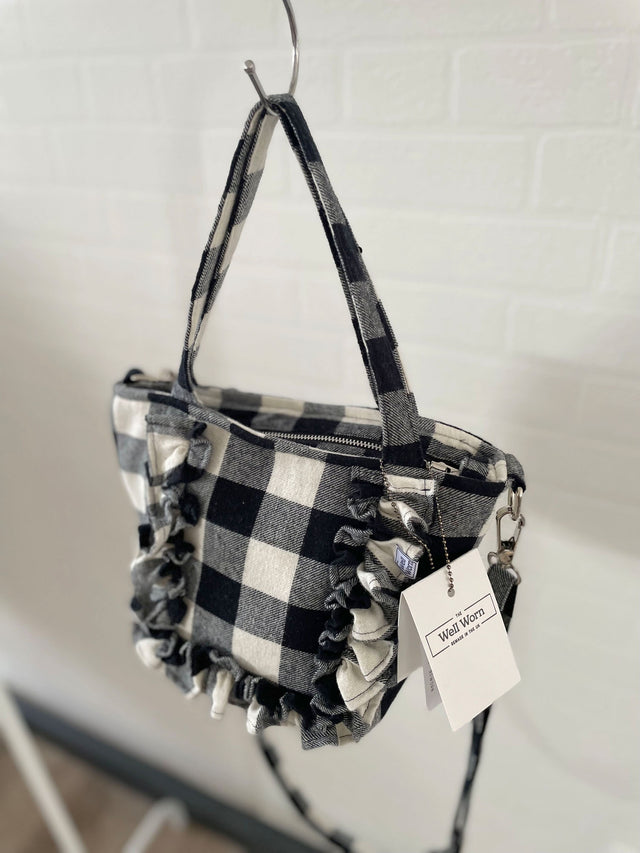 gingham tote hanging by wall