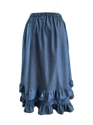Blue denim skirt with ruffled layers on a white background