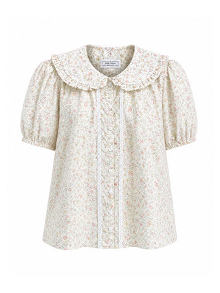 A cream-colored short-sleeve blouse with a delicate pink and green floral print, featuring a large ruffled Peter Pan collar and a button-up front.