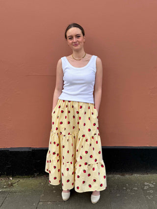 Strawberry print cotton maxi skirt with bold yellow stripes, made to order by UK brand The Well Worn

