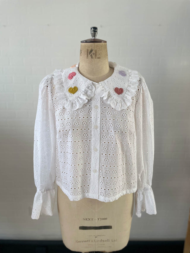 heart motif blouse on mannequin