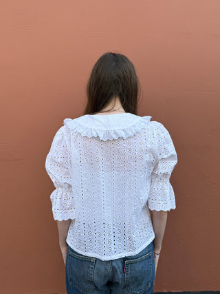 women wearing white embroidered blouse back