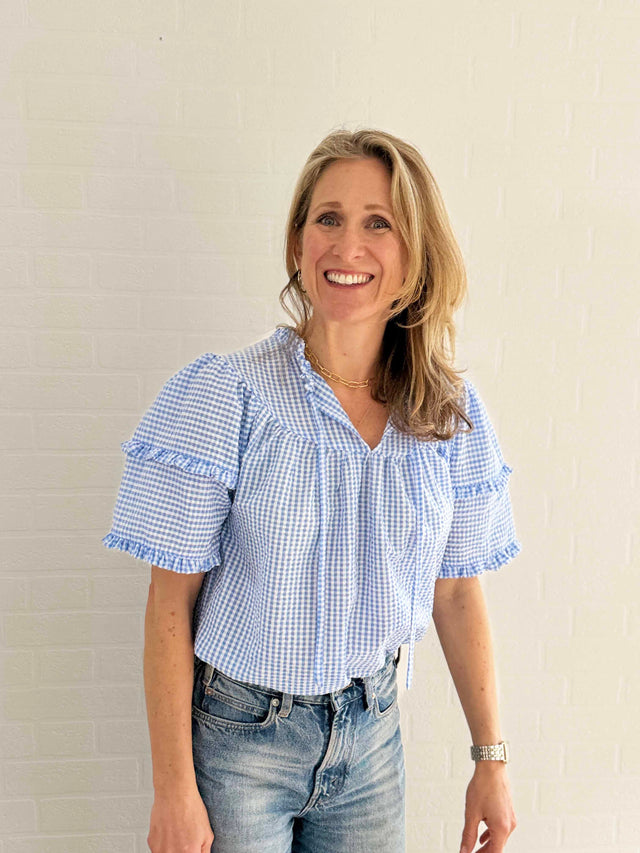 The Well Worn women laughing wearing blue gingham top 