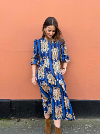 Sustainable cotton midi dress with puff sleeves and A-line skirt, model wears The Ada Dress by The Well Worn.