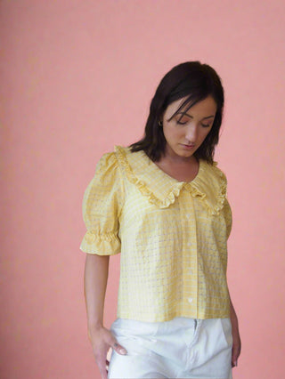 woman wearing yellow blouse