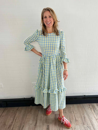 woman wearing gingham dress with pockets