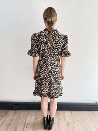Back view of The Peony Dress showing soft structure and swingy silhouette.