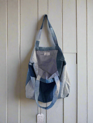 inside denim bag hung on wall 