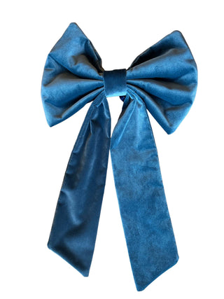 Blue velvet bow on a white background